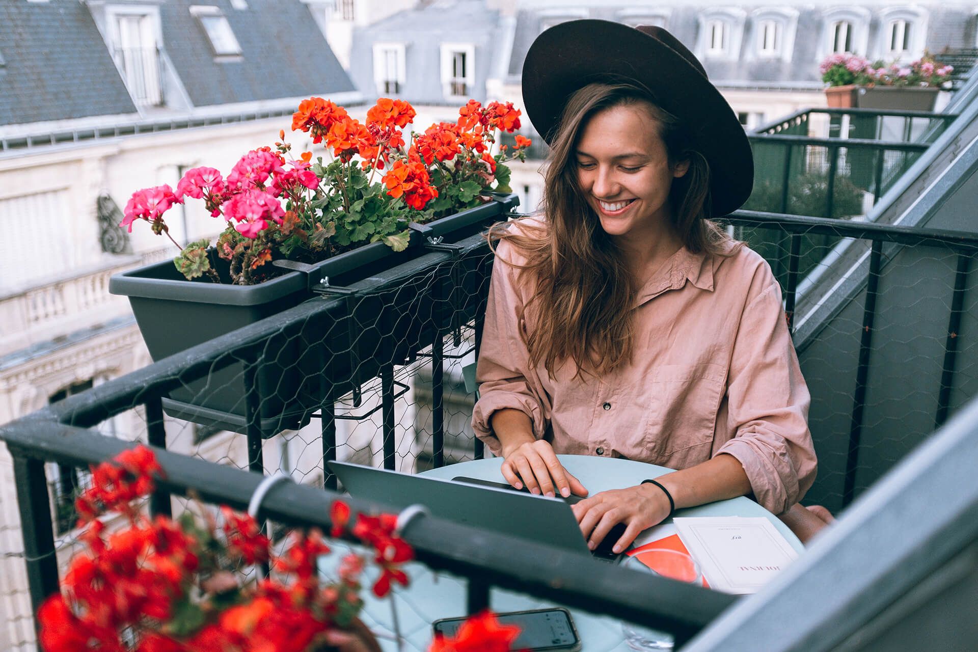 Girl planning her work and working on her balcony